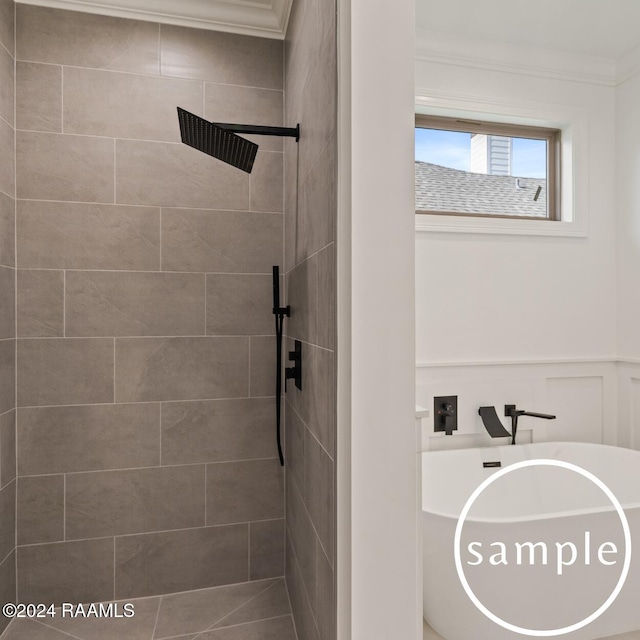 bathroom featuring crown molding and tiled shower