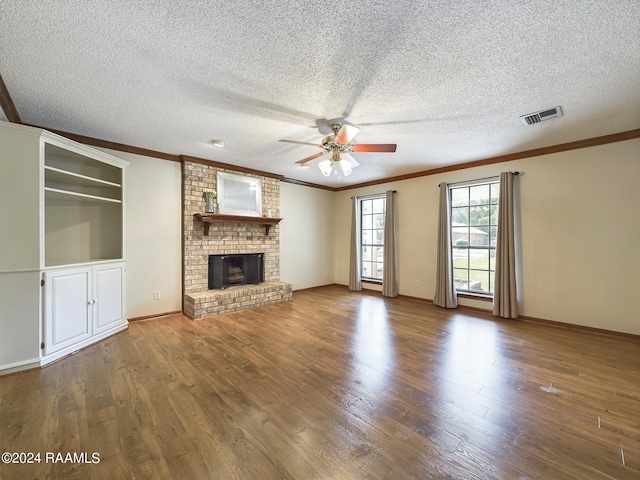 unfurnished living room with a textured ceiling, ceiling fan, and hardwood / wood-style flooring