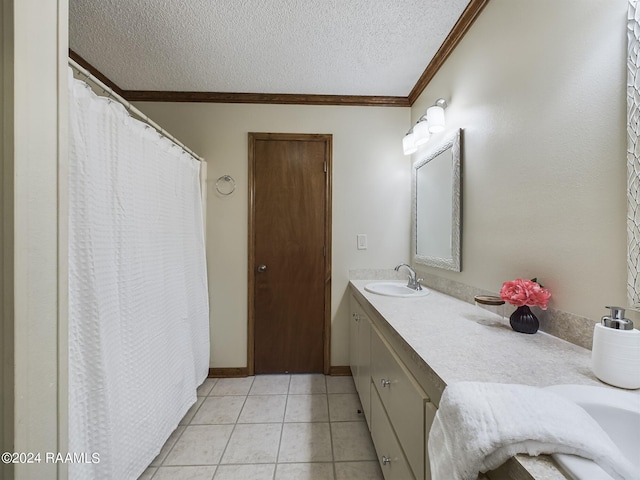 bathroom featuring vanity, tile patterned flooring, ornamental molding, and a textured ceiling