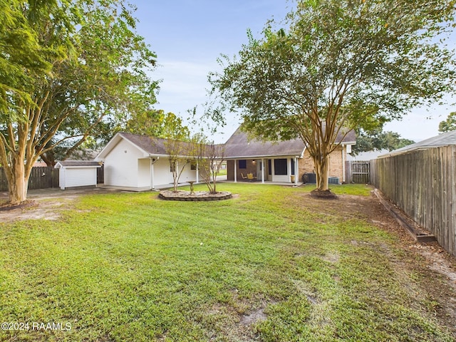 exterior space with a garage and a lawn