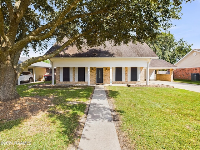 view of front facade with central AC and a front lawn