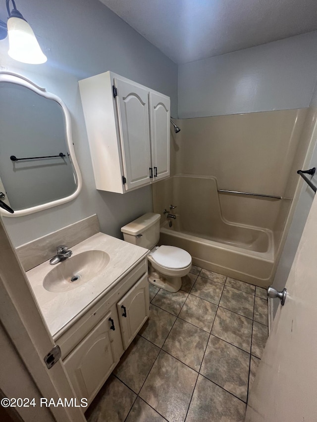 full bathroom with shower / bathing tub combination, tile patterned flooring, vanity, and toilet