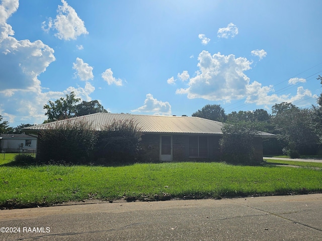 view of home's exterior featuring a yard