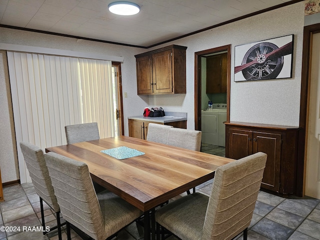 dining space with crown molding and independent washer and dryer