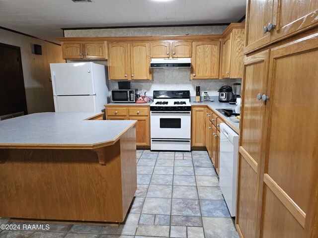 kitchen featuring decorative backsplash and white appliances