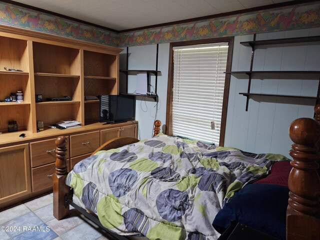 tiled bedroom featuring crown molding