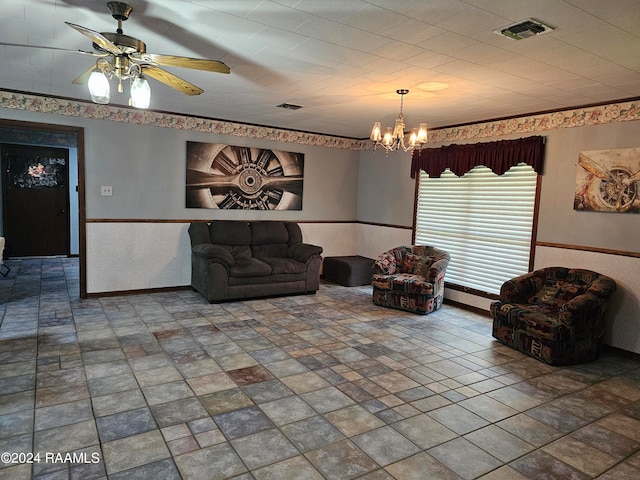 living room with ceiling fan with notable chandelier