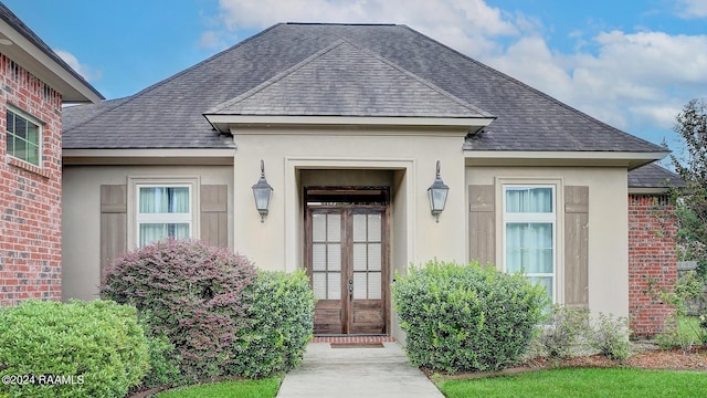 view of exterior entry featuring french doors