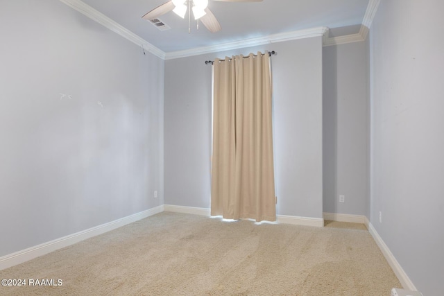 empty room featuring ornamental molding, ceiling fan, and carpet flooring