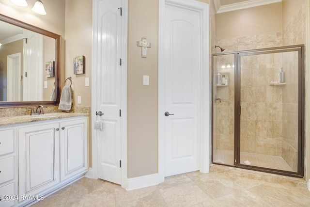 bathroom featuring crown molding, vanity, tile patterned floors, and a shower with shower door