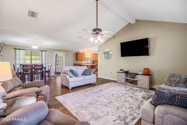 living room with dark hardwood / wood-style floors, vaulted ceiling with beams, and ceiling fan