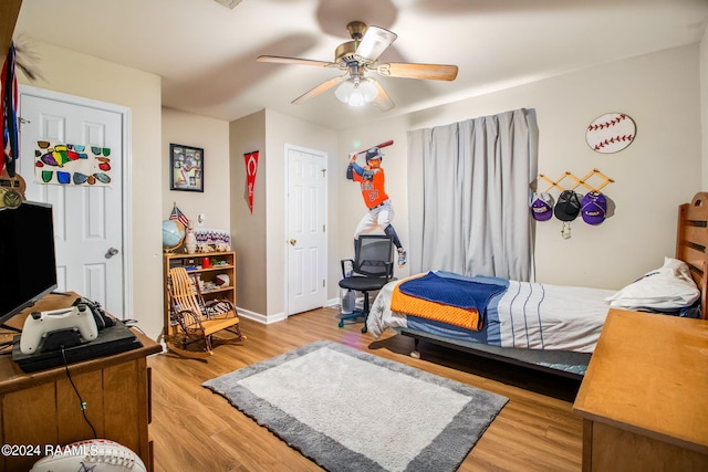 bedroom featuring ceiling fan and light hardwood / wood-style floors