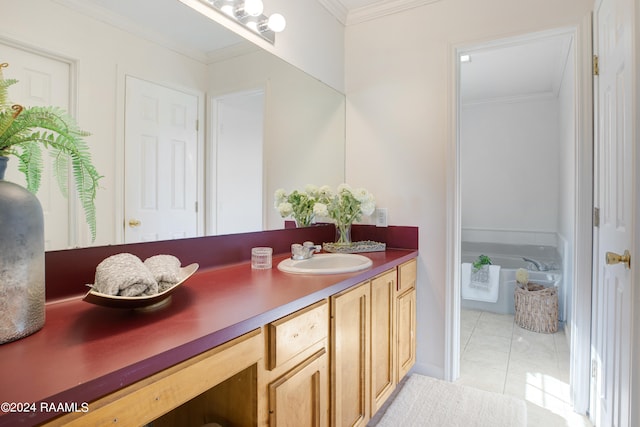 bathroom featuring ornamental molding, a tub to relax in, vanity, and tile patterned floors