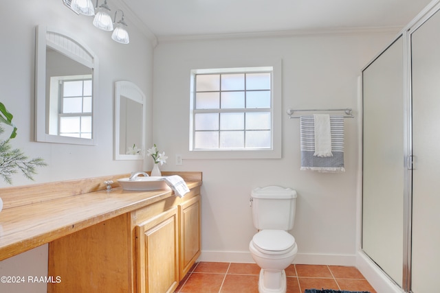 bathroom with vanity, walk in shower, crown molding, tile patterned flooring, and toilet