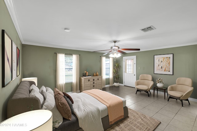 bedroom with ceiling fan, crown molding, and light tile patterned floors