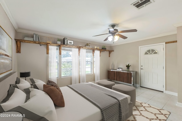 tiled bedroom with ceiling fan and ornamental molding