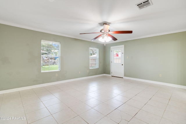 empty room featuring ornamental molding, light tile patterned floors, and ceiling fan