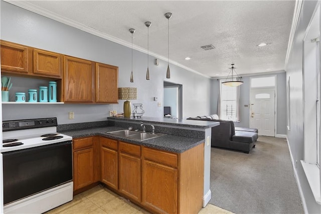 kitchen with visible vents, range with electric cooktop, brown cabinets, a peninsula, and a sink