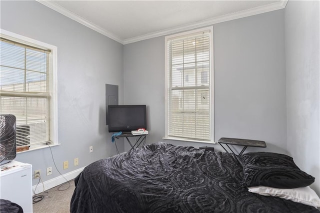 bedroom featuring ornamental molding, carpet flooring, and baseboards