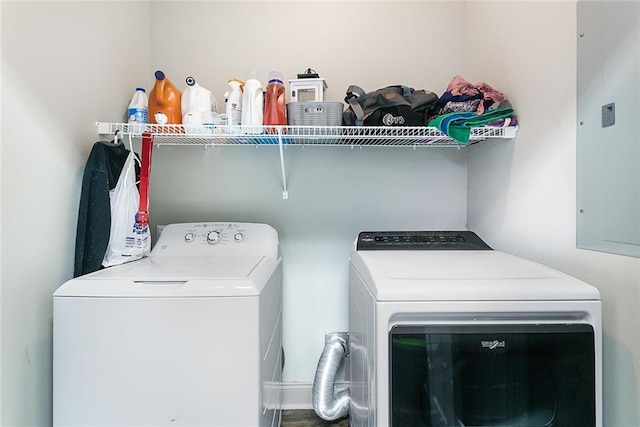 laundry room featuring laundry area, electric panel, and washer and dryer