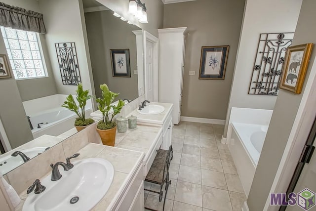 full bathroom featuring a garden tub, tile patterned flooring, baseboards, and vanity