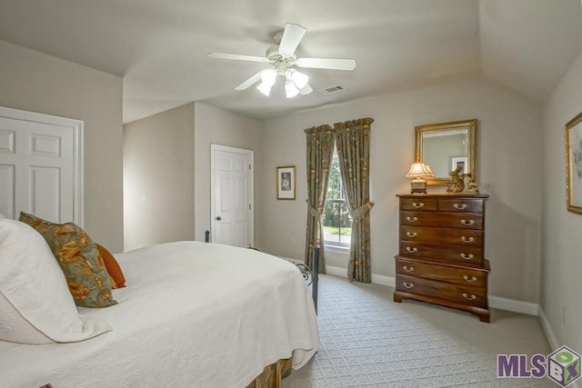 bedroom with baseboards, visible vents, a ceiling fan, and light colored carpet