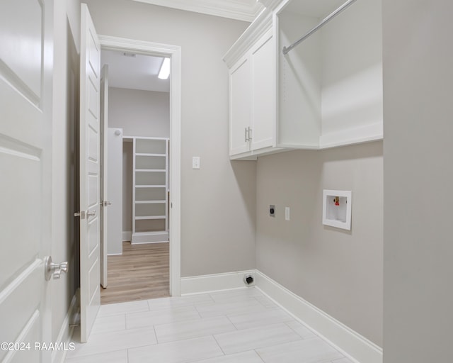 laundry room with washer hookup, cabinets, and hookup for an electric dryer