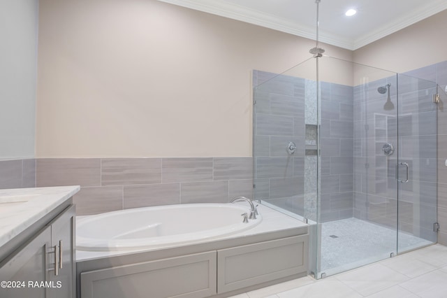 bathroom featuring vanity, crown molding, separate shower and tub, and tile patterned floors