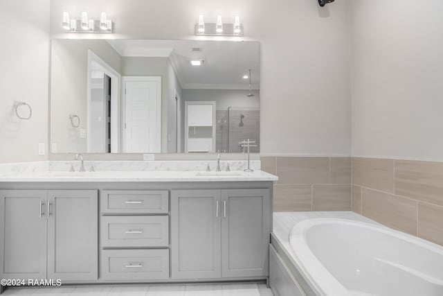 bathroom with crown molding, shower with separate bathtub, tile patterned flooring, and vanity