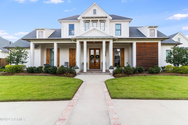 modern inspired farmhouse with a porch and a front lawn