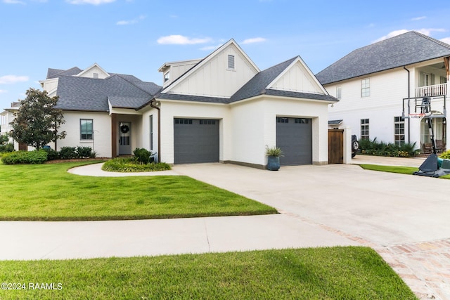 view of front of property featuring a garage and a front lawn