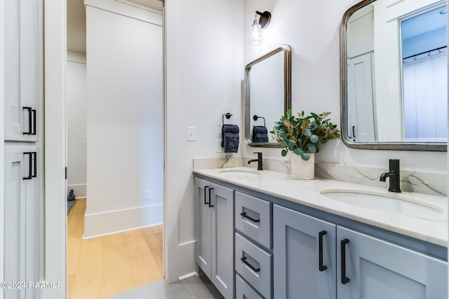 bathroom featuring hardwood / wood-style floors and vanity