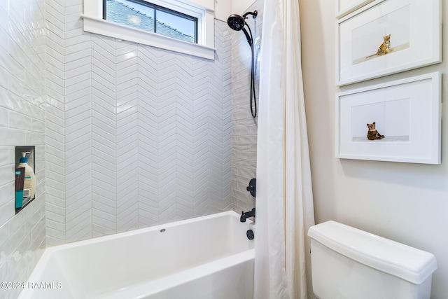 bathroom with shower / bath combination with curtain and toilet