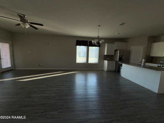 interior space featuring sink, ceiling fan with notable chandelier, and dark hardwood / wood-style flooring