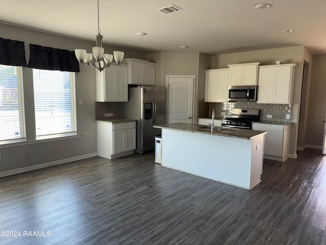 kitchen with a center island with sink, white cabinetry, dark wood-type flooring, sink, and stainless steel appliances