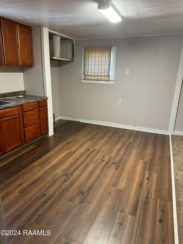 interior space featuring sink and dark hardwood / wood-style flooring