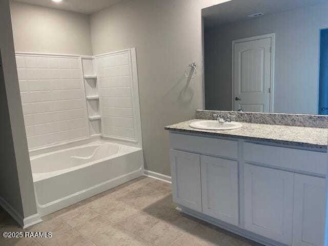 full bath with baseboards, vanity, and shower / tub combination