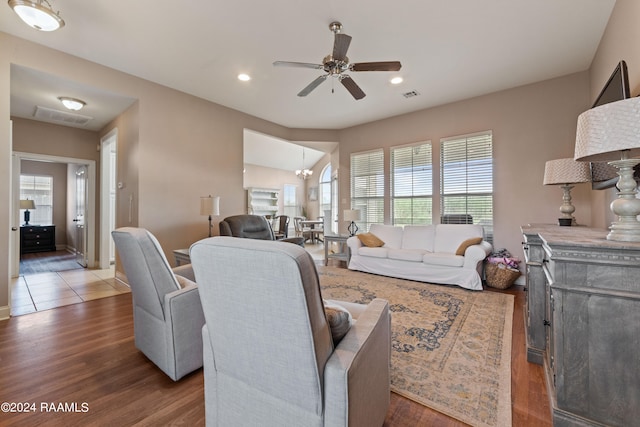 living room featuring ceiling fan and hardwood / wood-style floors