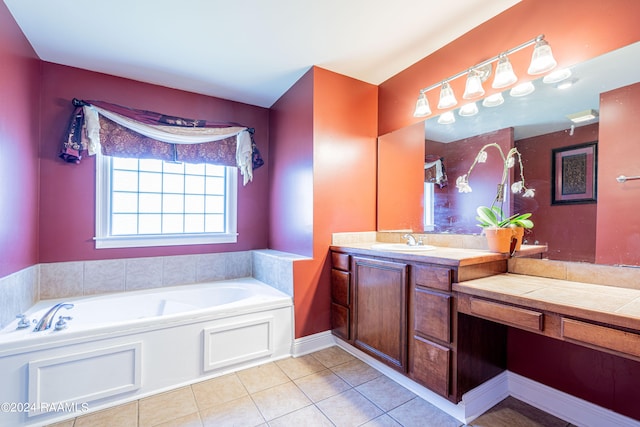 bathroom featuring vanity, a tub, and tile patterned flooring