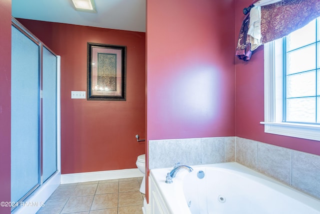 bathroom with toilet, shower with separate bathtub, tile patterned floors, and plenty of natural light