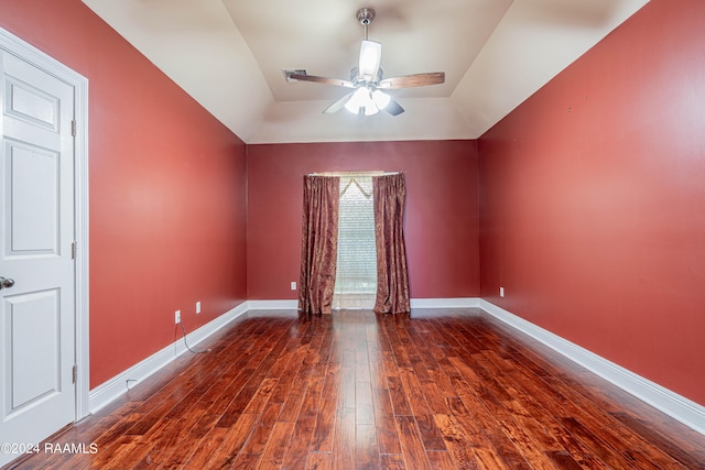 empty room with dark hardwood / wood-style floors and ceiling fan