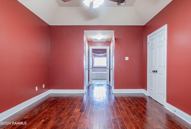 unfurnished room with dark wood-type flooring, vaulted ceiling, and ceiling fan