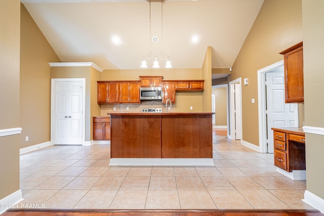 kitchen with pendant lighting, tasteful backsplash, light tile patterned flooring, and a chandelier