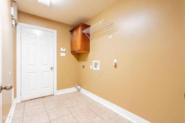 laundry area with cabinets, washer hookup, light tile patterned floors, and electric dryer hookup