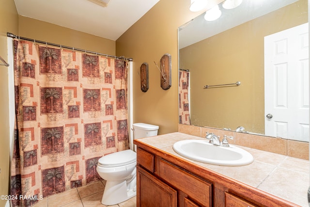 bathroom featuring vanity, toilet, tile patterned flooring, and a shower with shower curtain