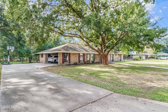 single story home with a front lawn and a carport