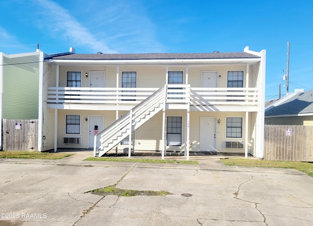 view of front of home featuring a balcony