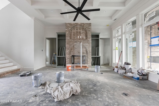 unfurnished living room featuring beamed ceiling, ceiling fan, crown molding, and coffered ceiling