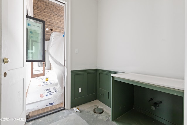 bathroom with concrete flooring