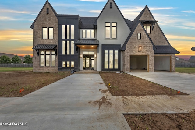 view of front of house with french doors and a garage